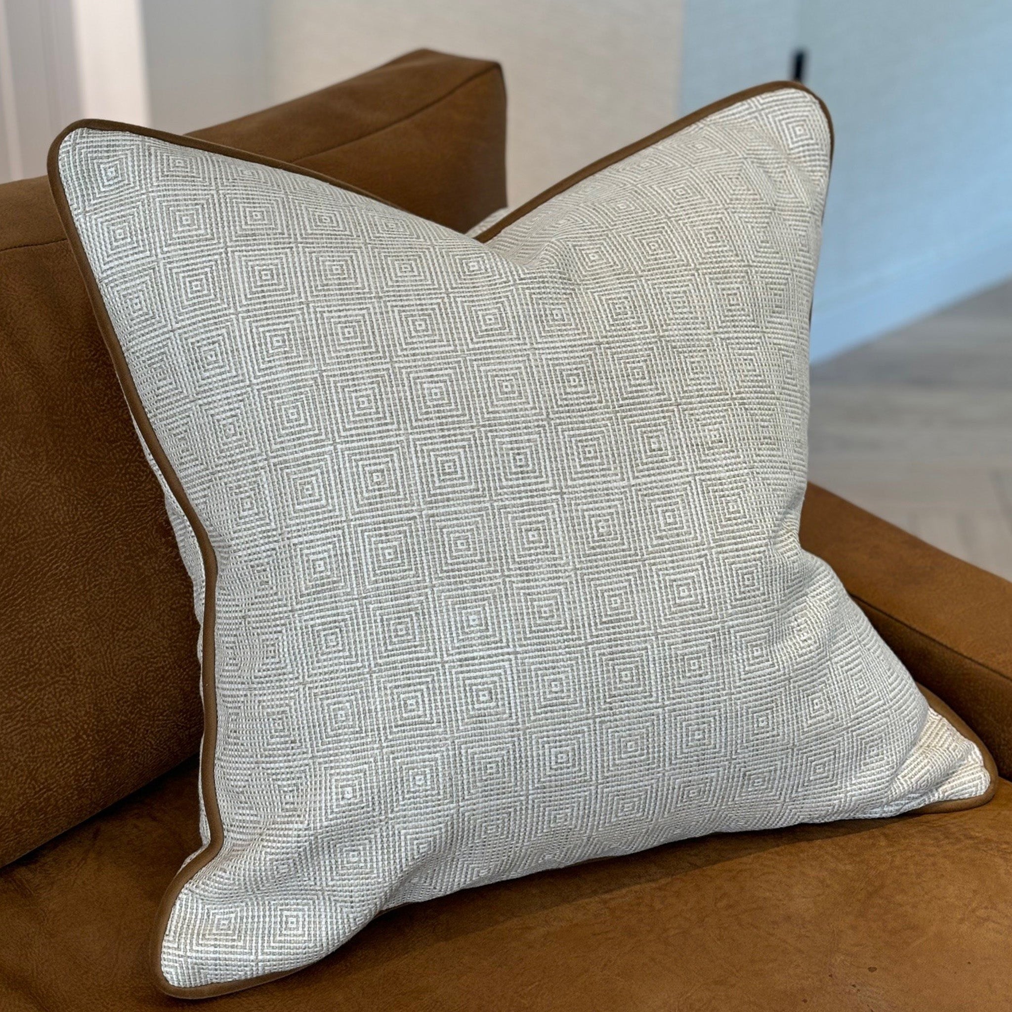Ecru Geometric Patterned Cushion with Tan Piping